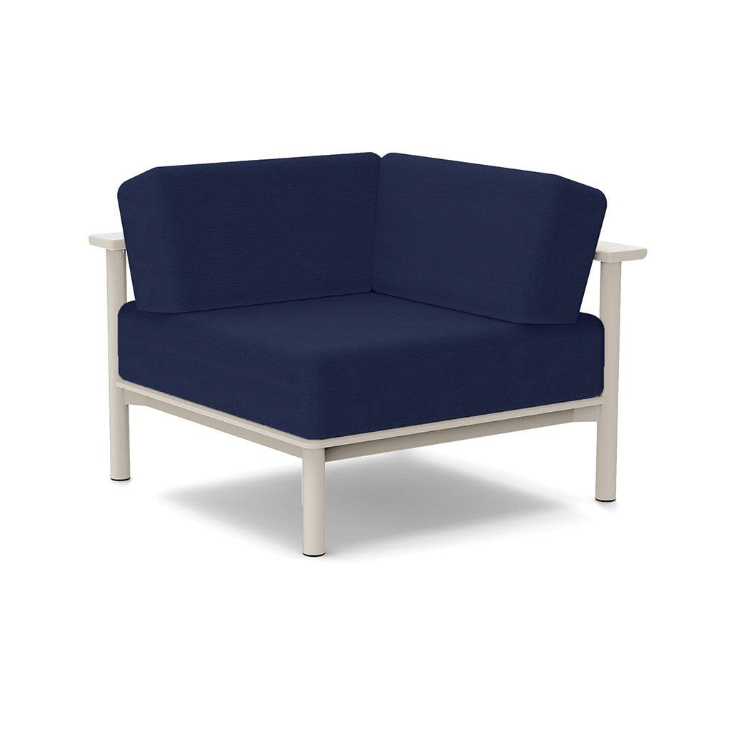 Studio image of a Corner Lounge Chair with Fog frame and Navy cushions.