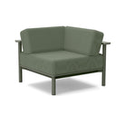 Studio image of a Corner Lounge Chair with Sage frame and Fern cushions.