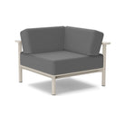 Studio image of a Corner Lounge Chair with Fog frame and Charcoal cushions.