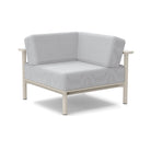 Studio image of a Corner Lounge Chair with Fog frame and Silver cushions.