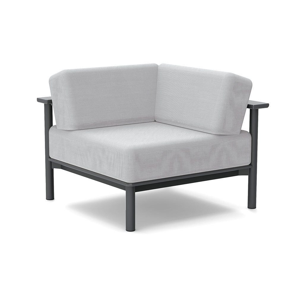 Studio image of a Corner Lounge Chair with Charcoal frame and Silver cushions.
